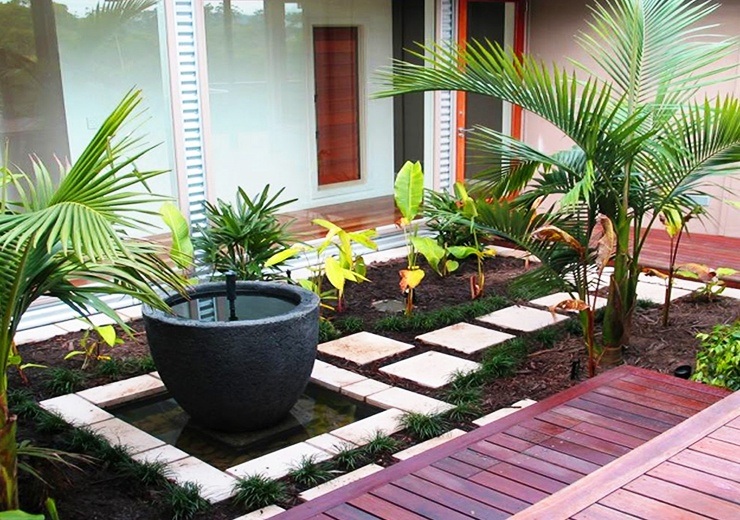 apartment garden on patio with stone walkway