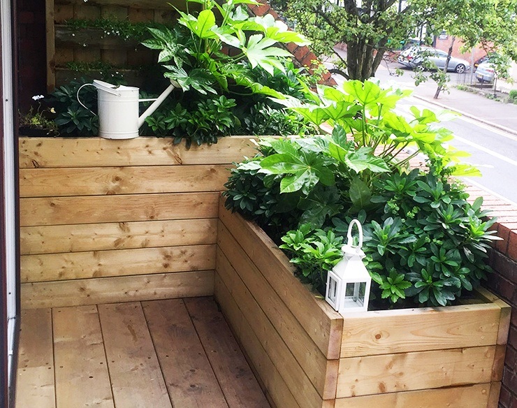 apartment garden with two by fours and pallet boards