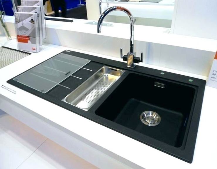 modern kitchen sink with drainage trap and vegetable rinse