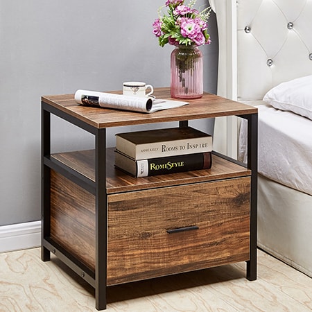 bedside tables are used in the bedroom beside the bed so the sleeper can rest books, drinks, and TV remotes, for instance.