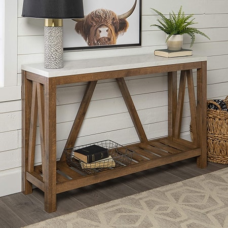 console tables can hold televisions, decorations behind a couch, or be placed along the wall in a hallway or entryway.