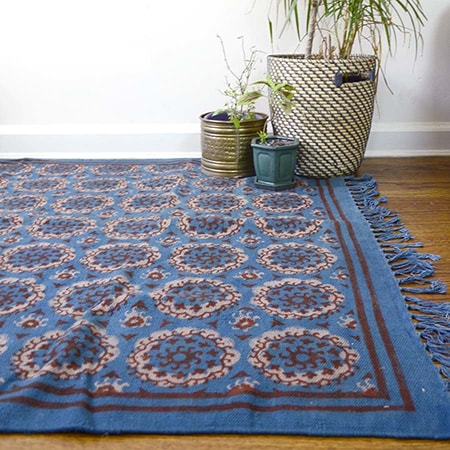 Cotton rugs are relatively inexpensive, look more casual, and come in nearly infinite designs and colors.