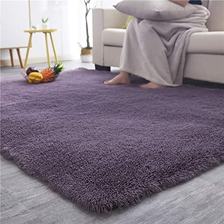 polyester rugs are tough and durable, hold their dye color very well, and have a higher price due to the effort to manufacture.