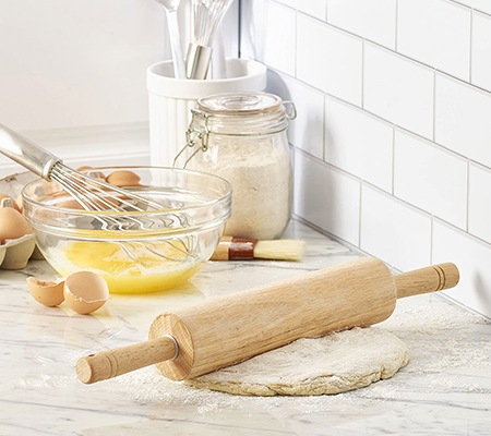 a rolling pin is a perfect alternative for a clothes wringer when you don't have one and your washing machine dryer isn't working