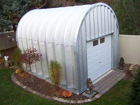 quonset huts are the perfect alternatives to garages, used by the military to store vehicles every day