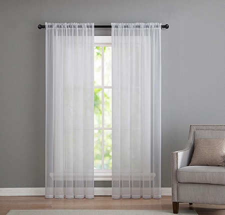 sheer curtains are one of the types of curtains used as either a liner for more opaque ones or as a decorative but less functional element