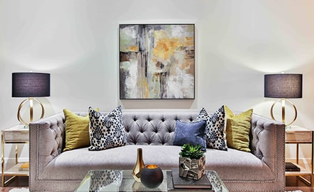 Having big artwork prints, paintings, or photographs is a great way to project a cozy and calming atmosphere into your living room