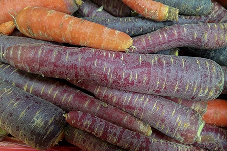 some kinds of carrots have unique colors on them and cosmic purple carrots' name talks for itself!