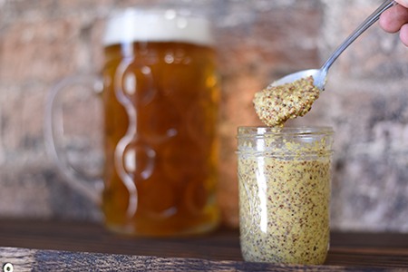 there are different types of mustard like whole-grain mustard that uses whole seeds, instead of grinding them