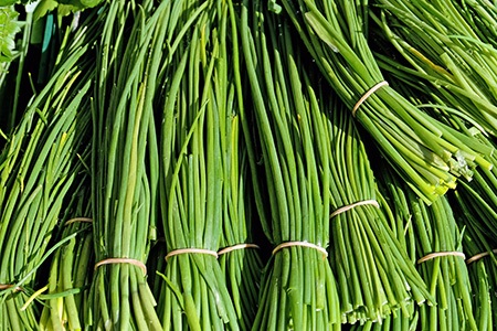 there are lots of examples of garnishes that belong to onion family and chives is one of them