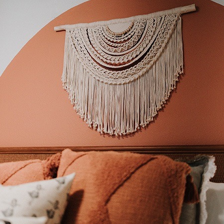 area rugs & macrame are popular headboard alternatives among women