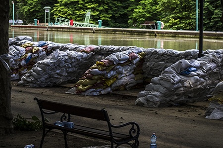 if you are looking for a quick and efficient alternative to french drain, try using sandbags