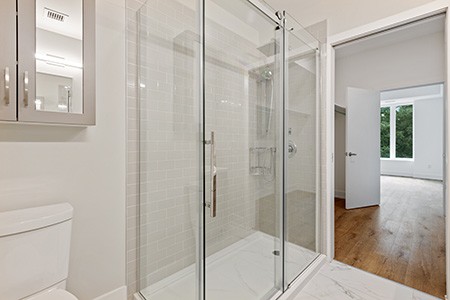 sliding panel door is perfect in terms of alternative shower curtain ideas since it prevents the water leakage and adds a beautiful look to your bathroom!