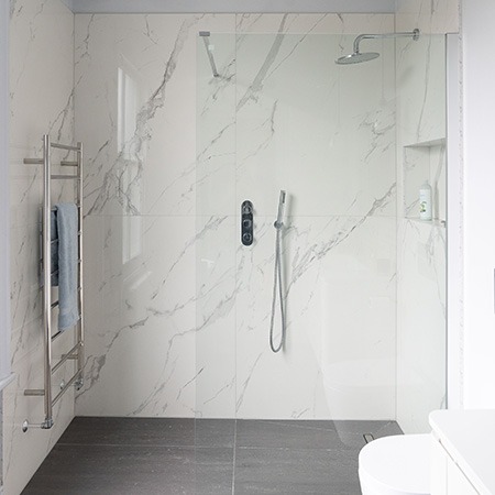if you are looking for shower walls without tile, try solid surface panels