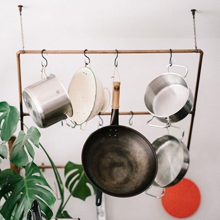 if you are planning to build a kitchen without cabinets, you should definitely use suspended racks to hang your stuff