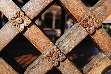 there are different wood fence styles like wood lattice fence that brings an aesthetic look to your garden