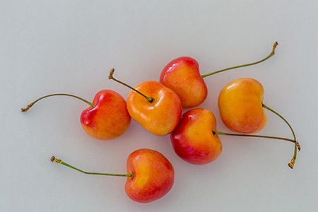 not all varieties of cherries have red color, rainier cherry is famous for its creamy-yellow color