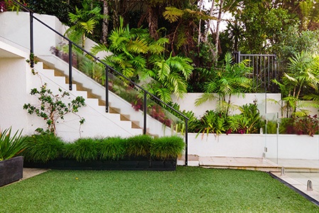 if any other retaining wall alternatives do not suit you, you can try to terrace the yard into several levels