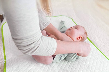 baby changing mat on floor