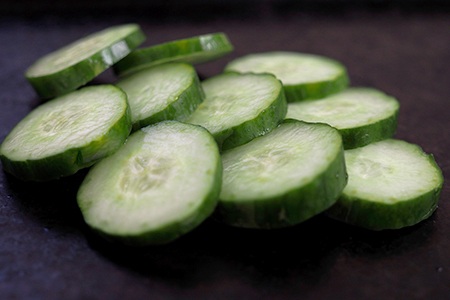 preparing to freeze cucumber slices