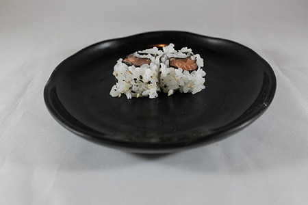 some kinds of sushi, like uramaki, are rolled inside-out, having an outer layer of rice and inner layer of seafood