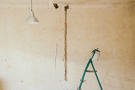 grease elimination & crack repairs for unfinished garage walls can help you finish the project faster