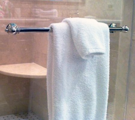 where to hang wet towels after shower? the easiest place is the shower door itself