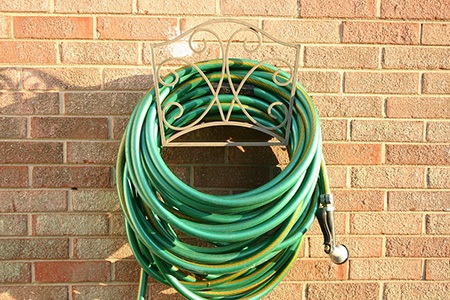 it would be so wise to check the pros & cons of garden hose stands before picking an in-ground hose holder
