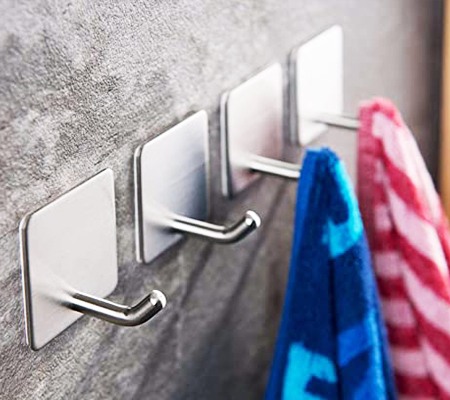 wall hooks are great for hanging wet towels in small bathroom because they take up nearly zero space, being pressed right up against the wall