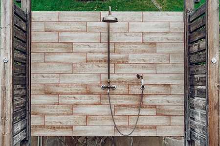 Heated outdoor outlet shower