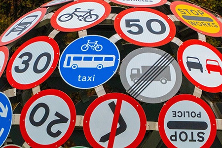 if your neighbors are parking in front of your house do not try to use illegal signs to prevent it