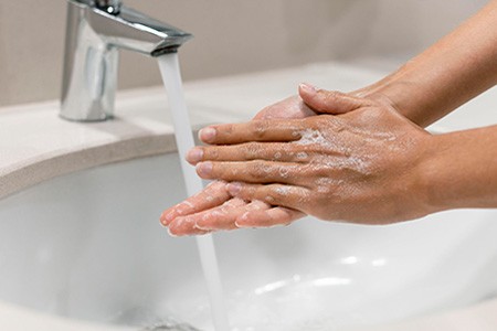 wash your hands to remove as much spray foam as possible