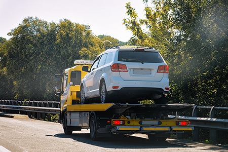 can the police tow a car that's blocking a driveway?