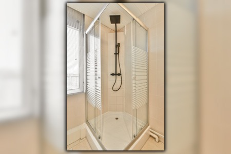 what are the smallest dimensions of a corner shower stall?