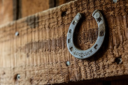 are you considering hanging your horseshoe over a door? here are ways on finding the ideal horseshoe location & placement